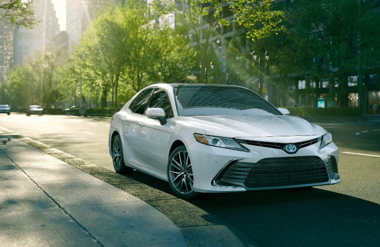 Front/side angled shot of white 2021 Toyota Camry